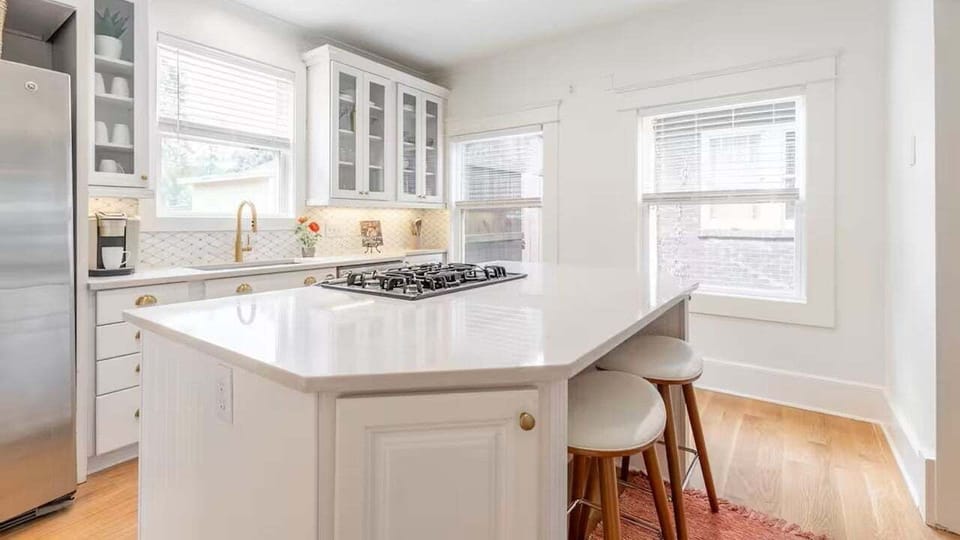 Kitchen island with stove and breakfast bar seating