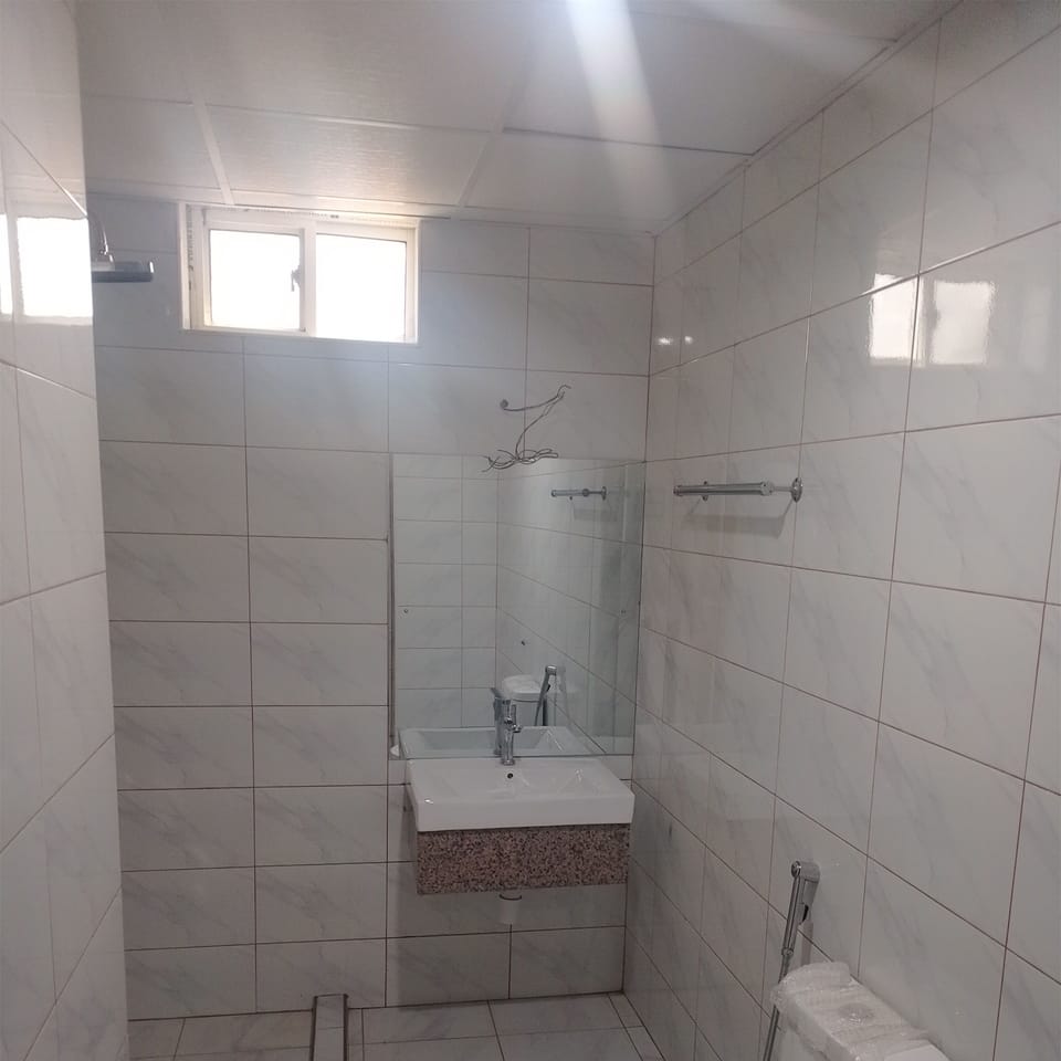 Shower, towels, soap, toilet paper