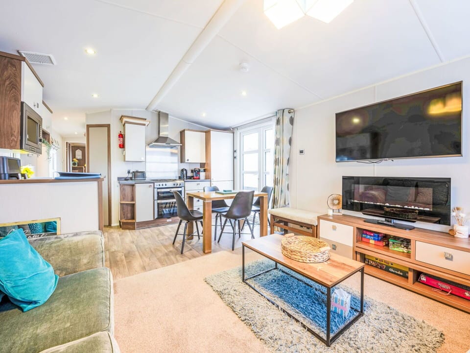 Apartment, Wood Stain, Chair, Wood Flooring, Living Room, Home Appliance, Major Appliance, Cabinetry