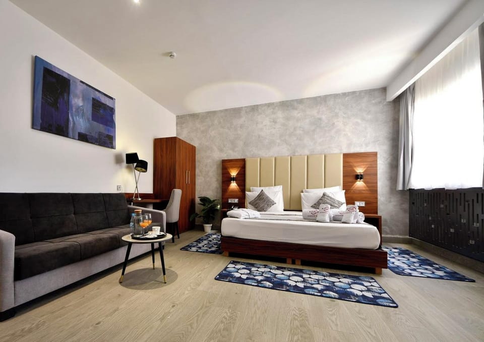 Standard Double or Twin Room | Minibar, in-room safe, desk, laptop workspace