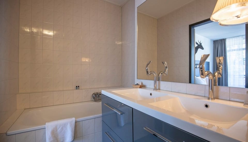 Refresh with a long soak and a bright double vanity.