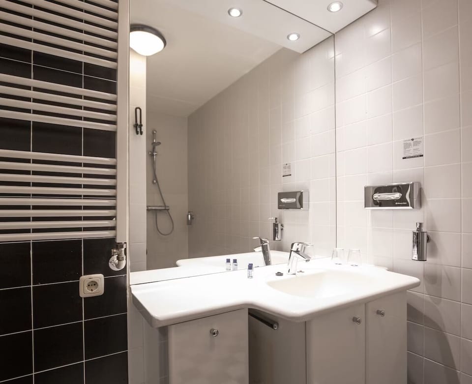 Refresh after adventures in a bright, spotless walk-in shower.