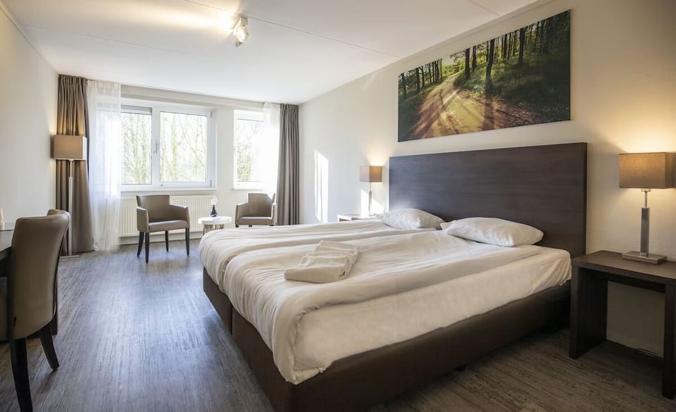 Sink into plush bedding and wake to sunlit forest views.