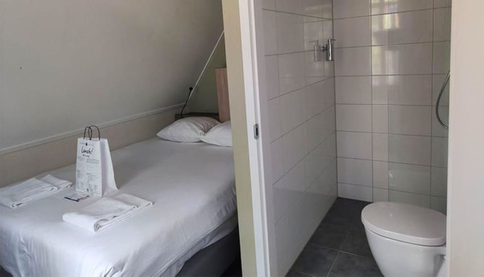 Freshen up fast with a simple ensuite shower and essentials.