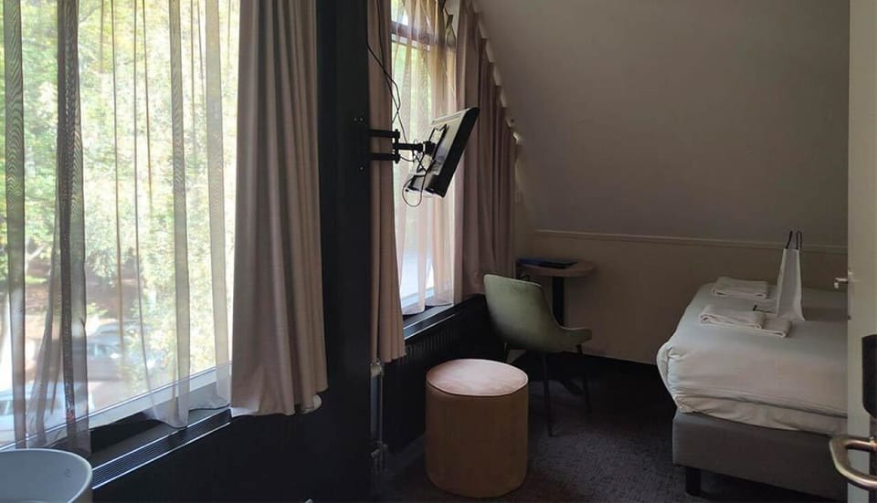 Relax by the window with peaceful views and a comfy chair.