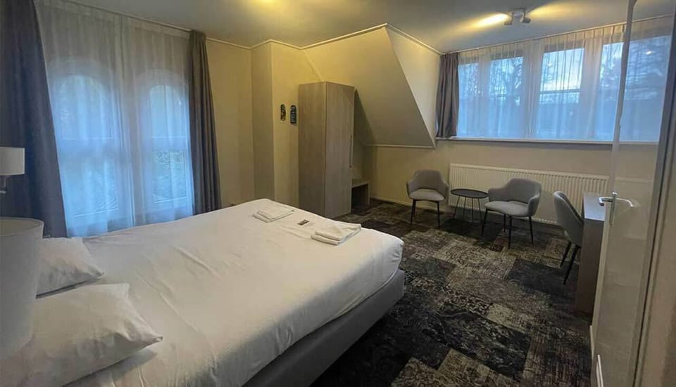 Unwind in a bright, spacious room with cozy seating.