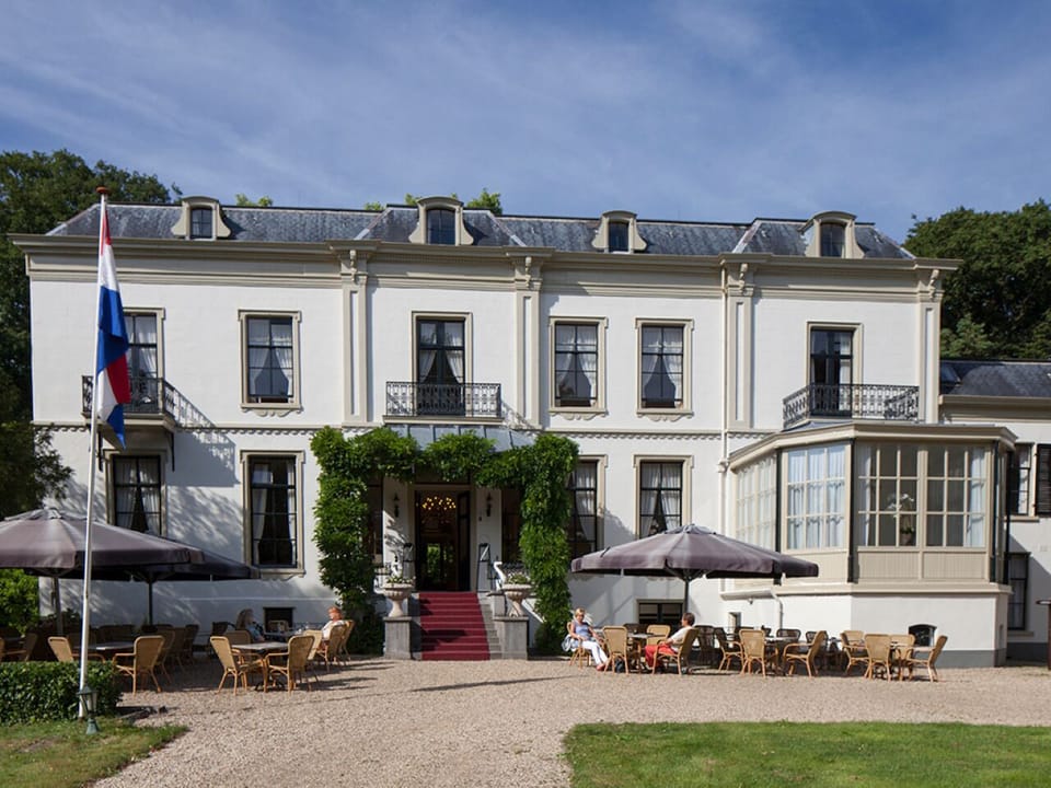 Picture yourself arriving at a stately hotel with sunny terrace.