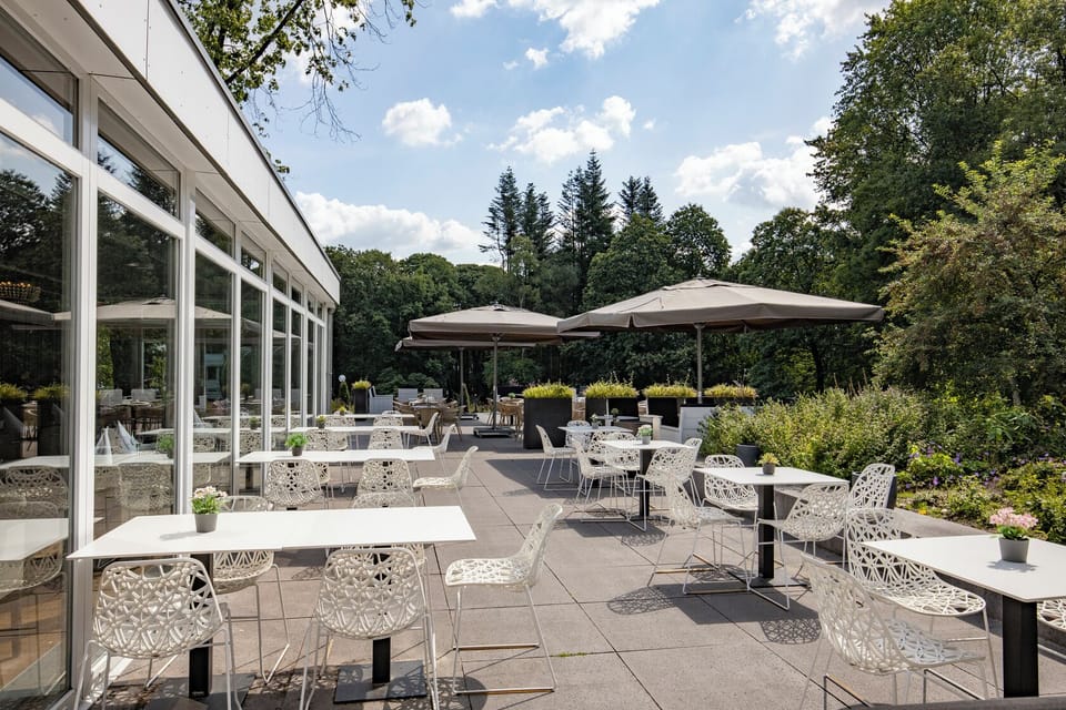 Savor sunny terrace meals surrounded by tranquil garden views.