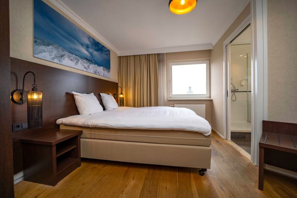 Wake up refreshed in a serene room with easy bathroom access.