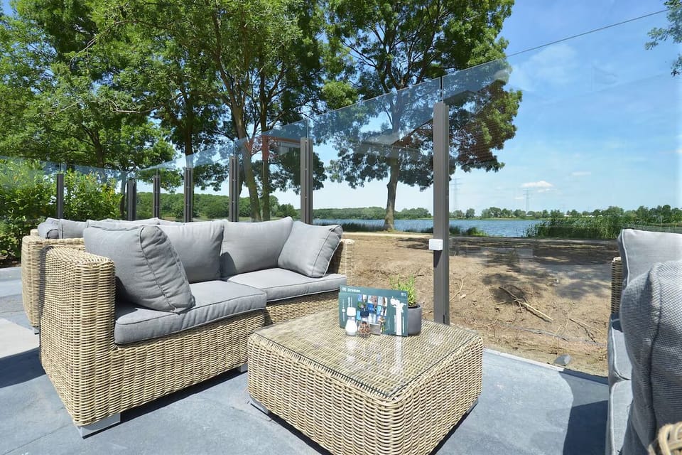 Sip a drink outdoors while gazing across the calm water.