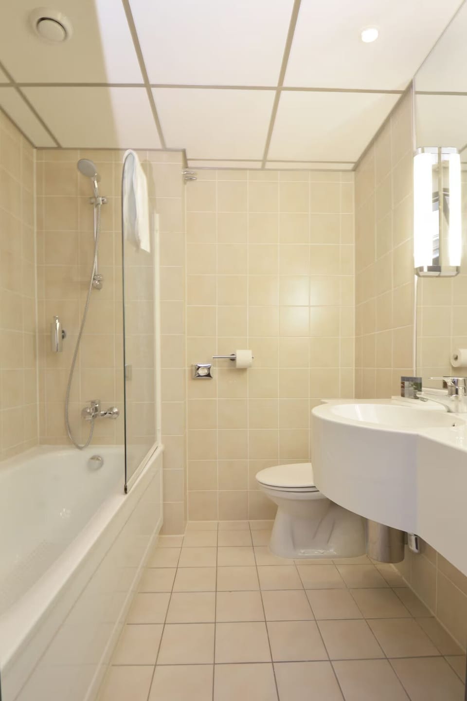 Refresh easily with a bright bath, tub, and rainfall shower.