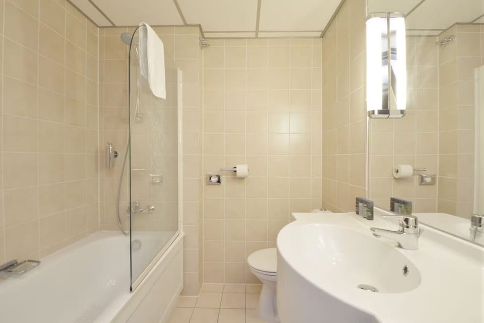 Start your day in a spotless bathroom with wide vanity space.