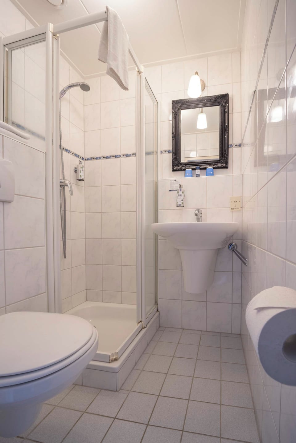 Refresh under a spacious shower after a full day out.