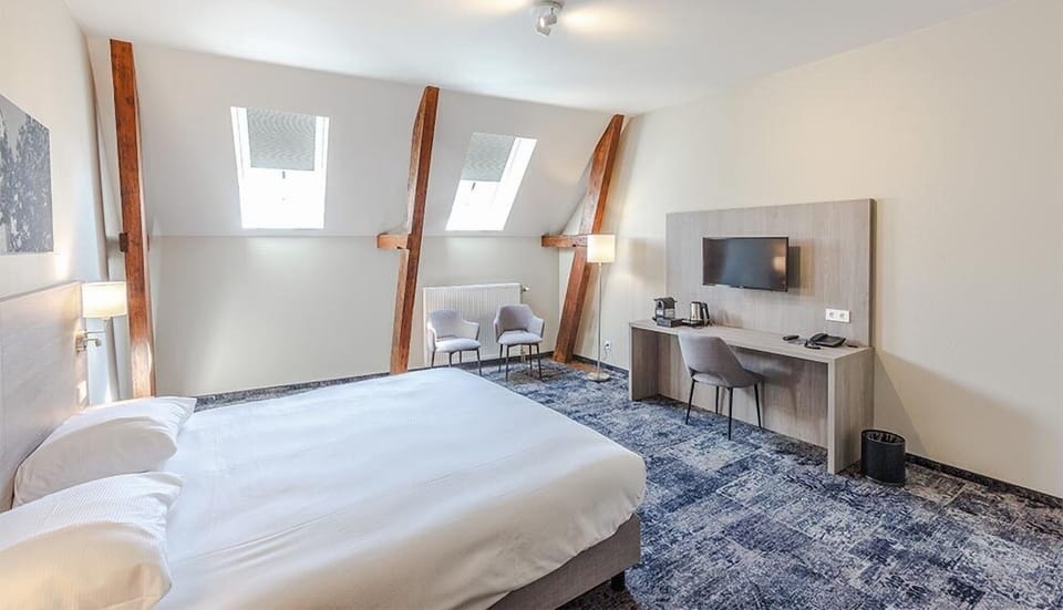 Relax in a spacious, skylit bedroom made for deep rest.