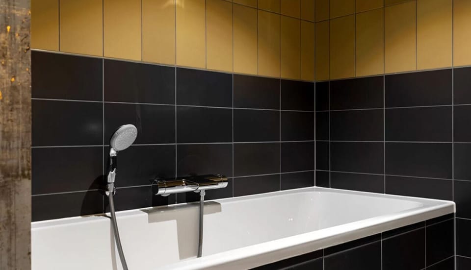 Soak away the day in a sleek, deep bathtub.