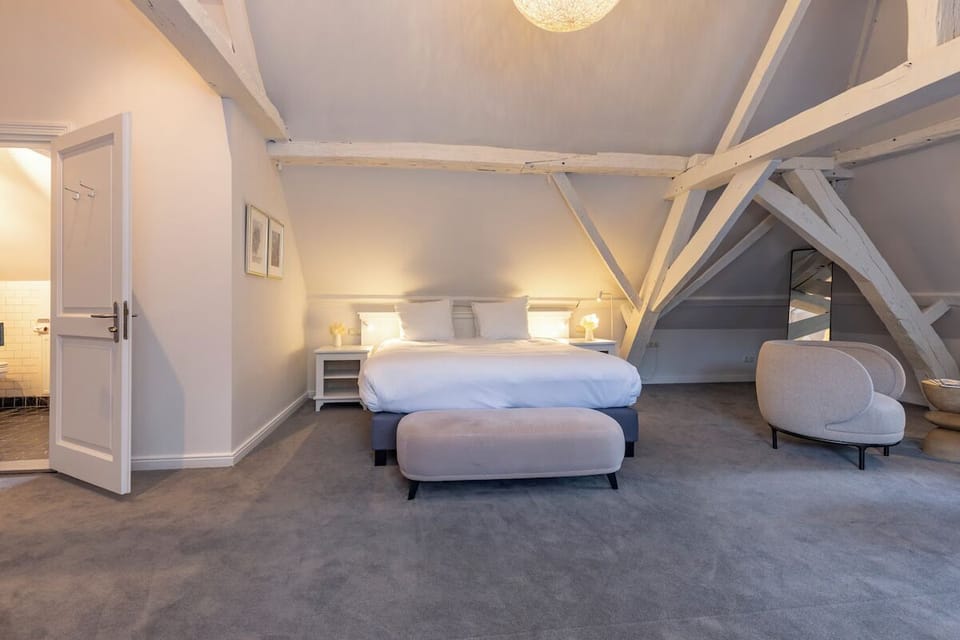 Drift off comfortably with bedside lamps and crisp linens.