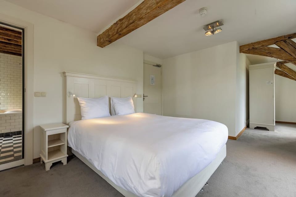 Sink into a plush bed in this airy, peaceful retreat.