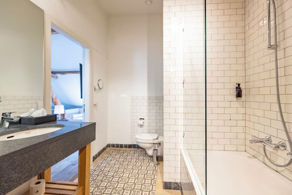 Prepare with ease in a bright bathroom with clean modern tile