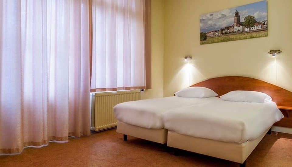 Relax together in a tidy double room with workspace corner.