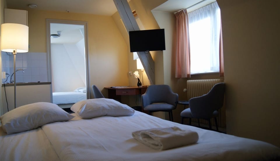 Recharge in a warm room with seating and in-room TV.