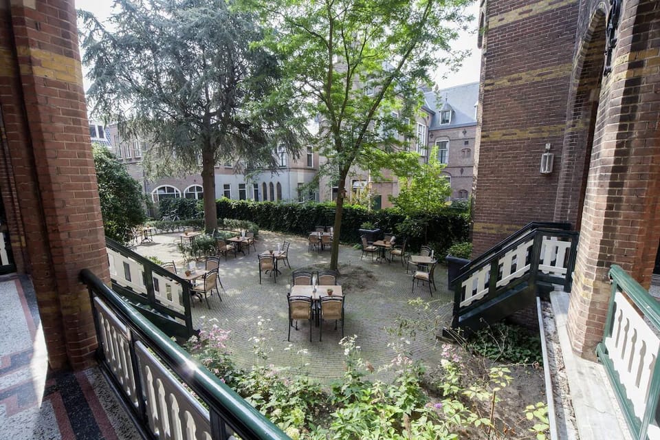 Look out over the leafy courtyard and plan a peaceful day.