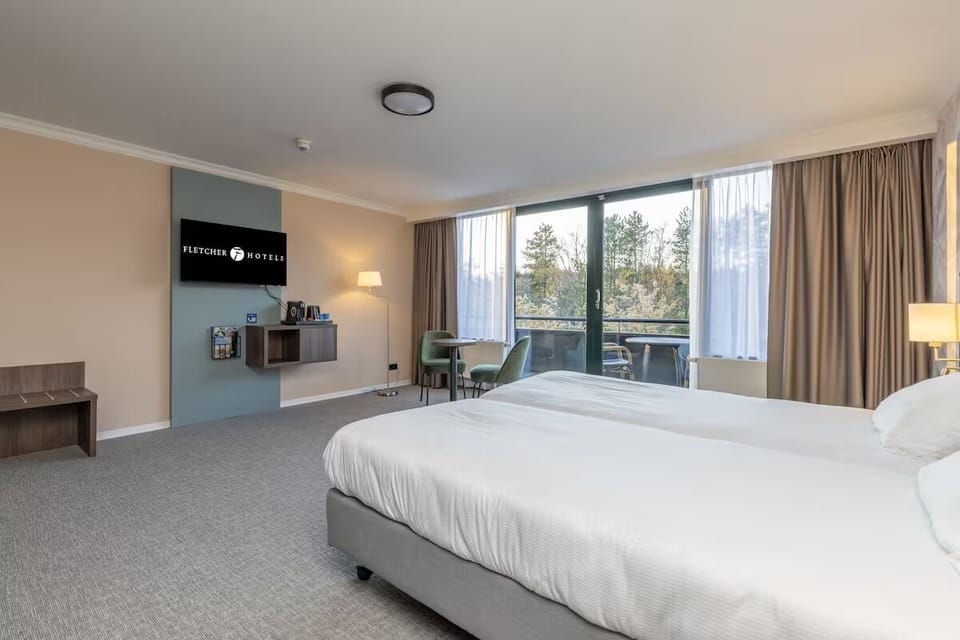 Wake to treetop views through bright balcony doors.