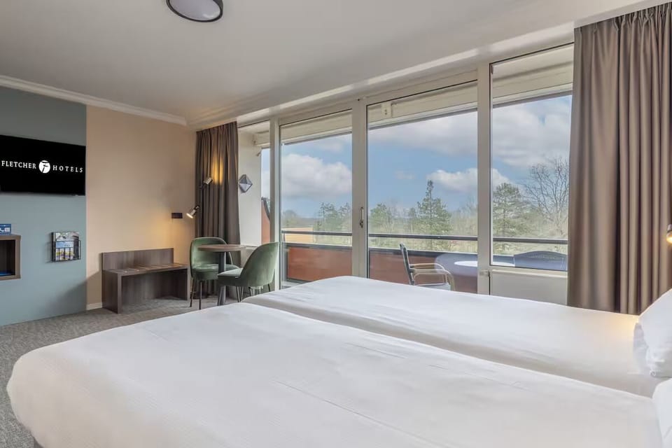 Sip morning coffee beside panoramic windows and private balcony.