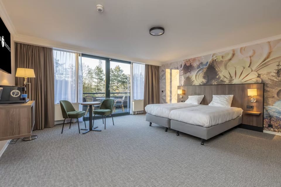 Relax in a bright king room with balcony seating.