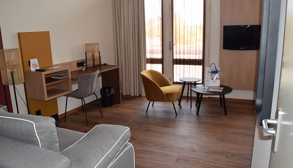 Settle in at the desk, then relax by the TV.