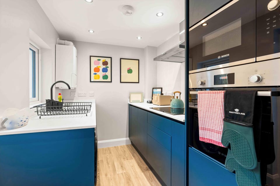 Modern fully equipped kitchen with dining space, ideal for self-catering and relaxed meals