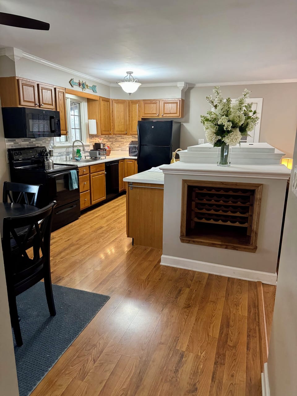 pacious kitchen with island seating & built-in wine rack
