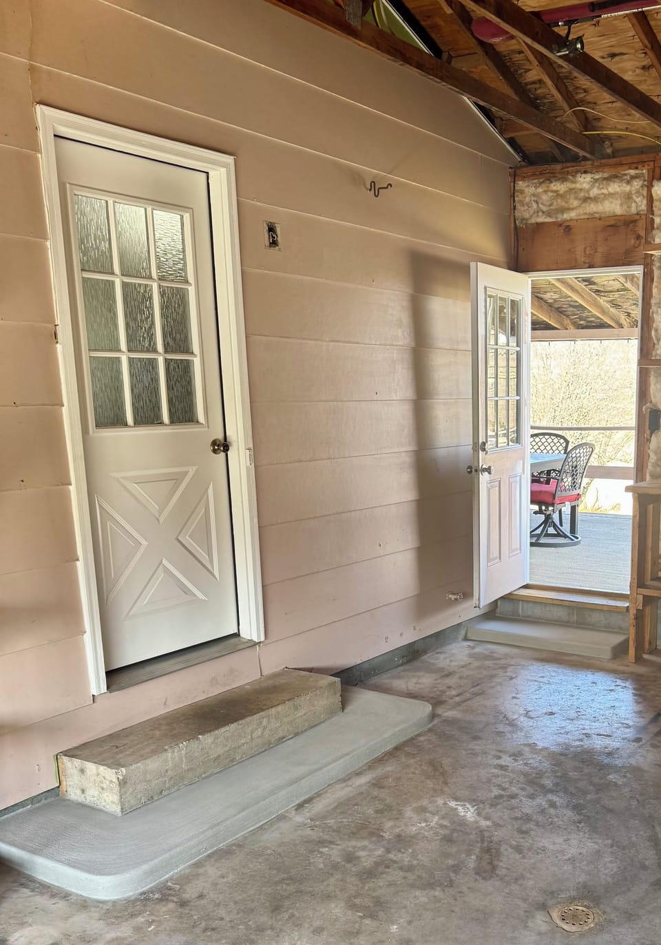 Access deck by door inside the house beside the refrigerator for deck access.