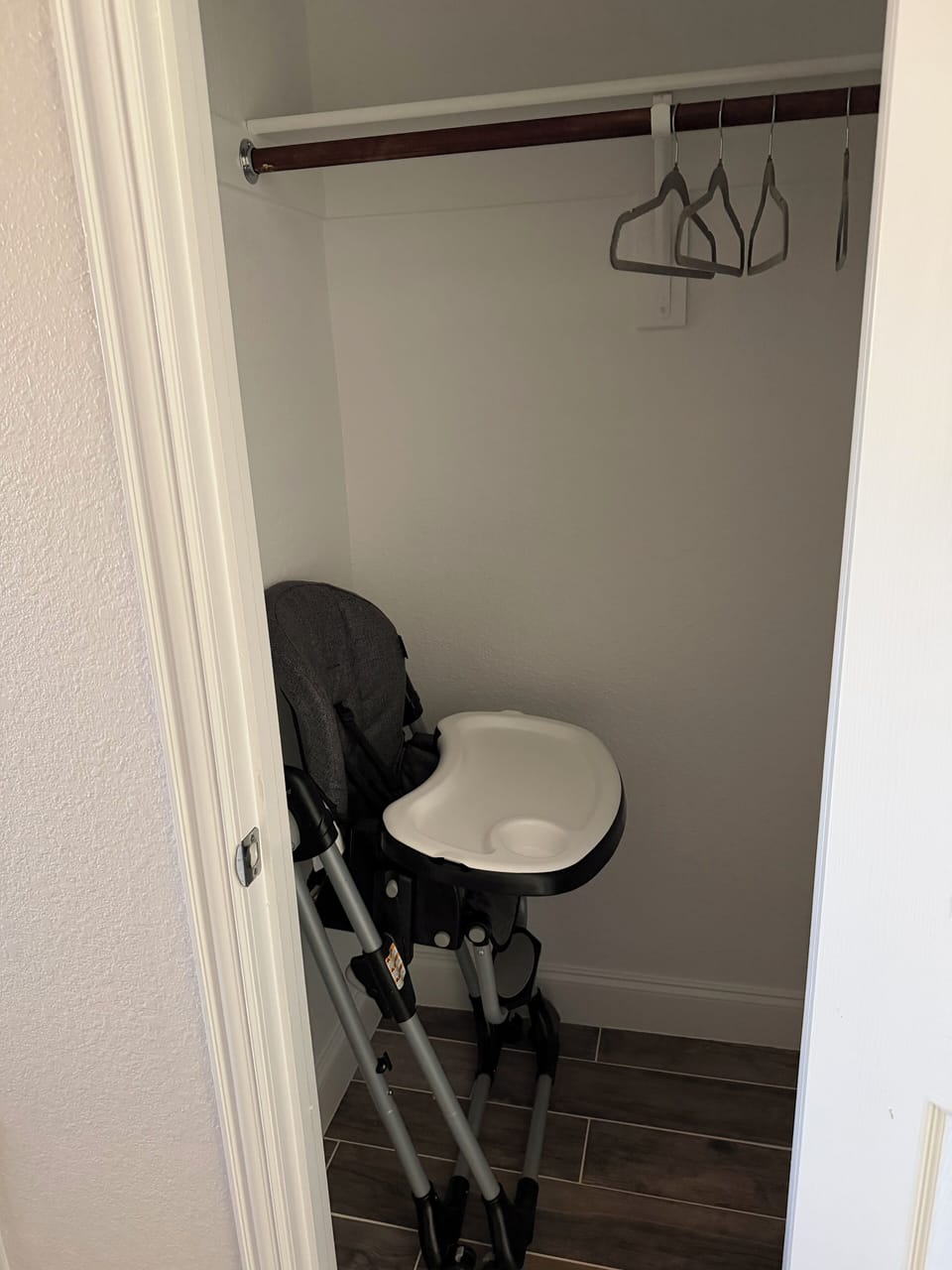 Elevate your child to table height, featuring a safety harness and food tray.