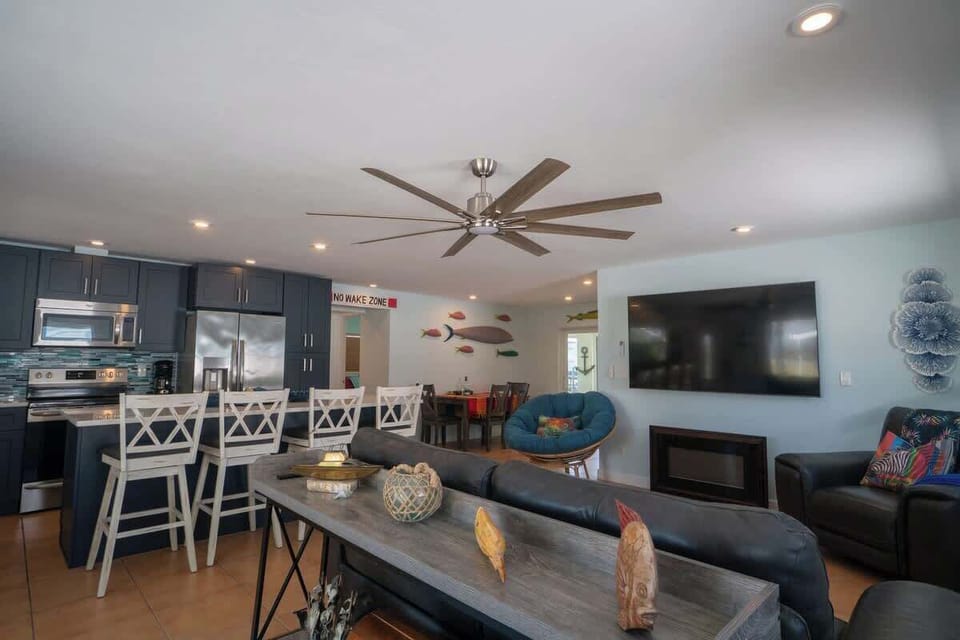Features an open‑concept living room, dining area, and kitchen, creating a bright, spacious layout perfect for relaxing and entertaining.