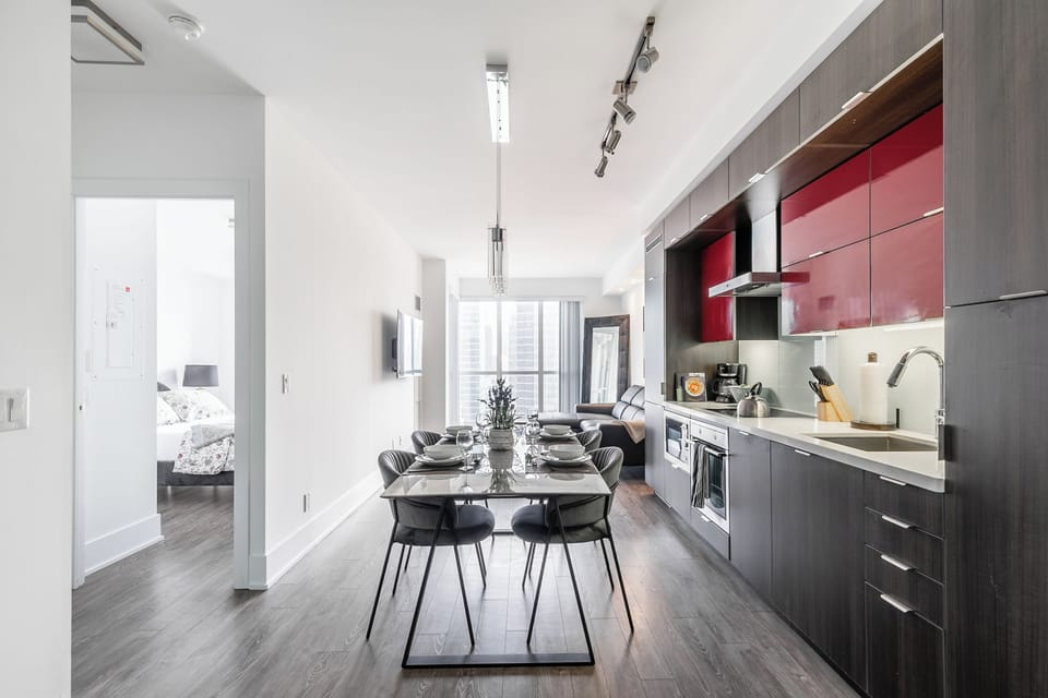 Business Apartment, City View | Living area | 65-inch Smart TV with digital channels