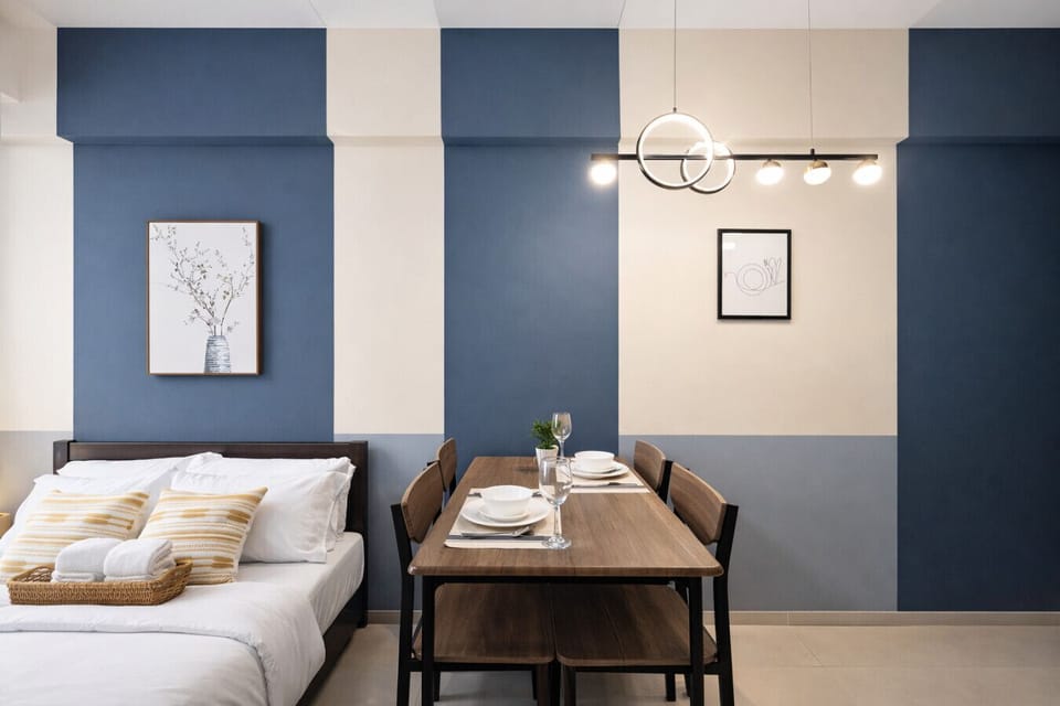 Dine in style—clean dining table for two with a functional layout perfect for short or long stays.