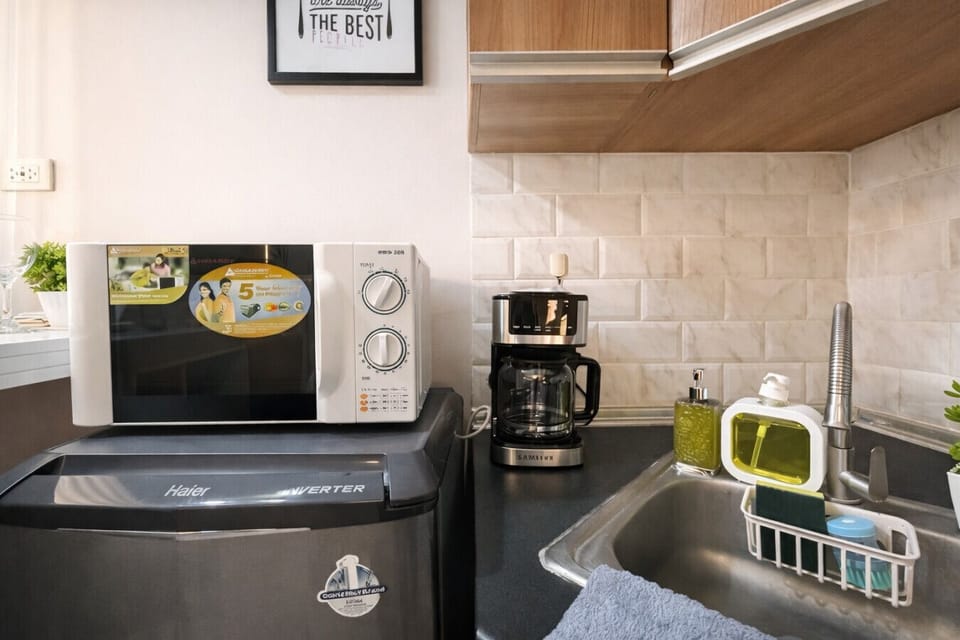 Enjoy added convenience with a microwave, mini fridge, coffee maker, and kitchen essentials—perfect for quick meals and morning coffee.