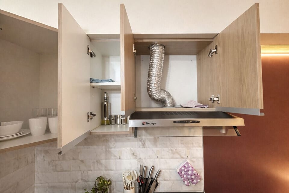 Well-stocked kitchen with organized cabinets, dishes, and essentials—everything set up for an easy, comfortable stay.