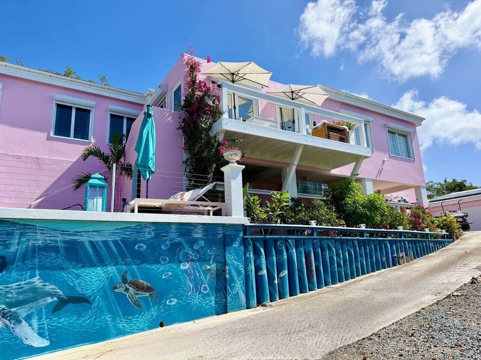 Exterior view of 2nd floor balcony, pool, and our beautiful Ocean Life Mural painted by Water Island artist Colleen Tapp