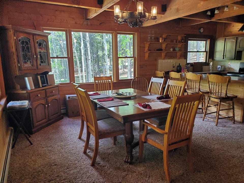 Dining Room, with the kitchen area in the back-right of the photo. 