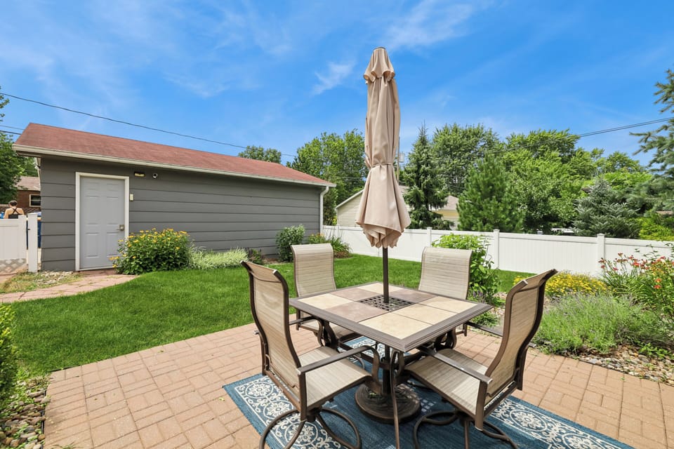 Outdoor dining with umbrella seating - perfect for morning coffee or dinner.