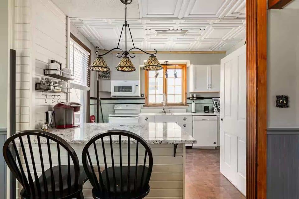 Kitchen and Dining Area Overlooking Backyard and Fire Pit