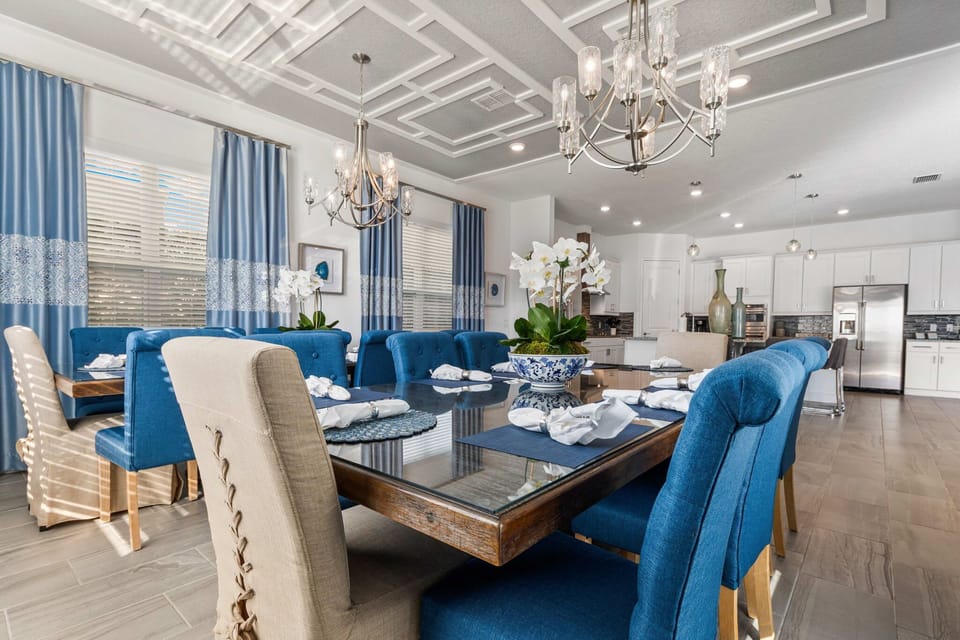 Two matching dining tables with seating for sixteen—because vacation memories are made around the table.