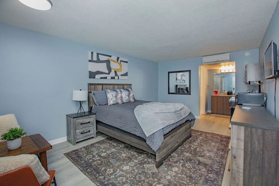 Plush Queen Bed in a studio apartment