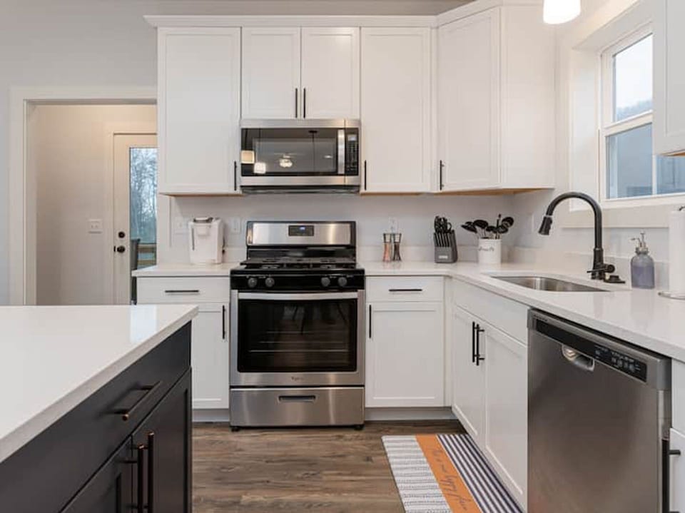 Kitchen is outfitted with a gas range