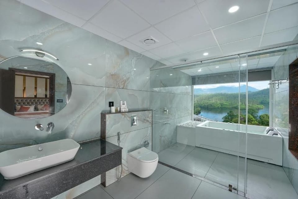 Luxury Suite, Balcony, Lake View | Bathroom | Shower, free toiletries, slippers, towels