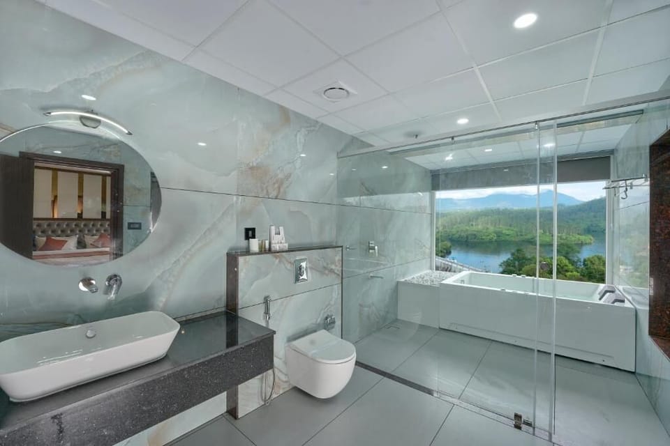 Luxury Suite, Balcony, Lake View | Bathroom | Shower, free toiletries, slippers, towels