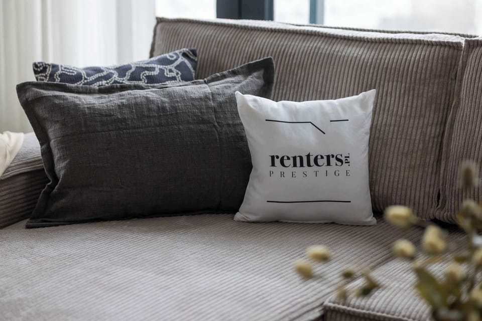 The living room has a modern look and comfortable furniture.