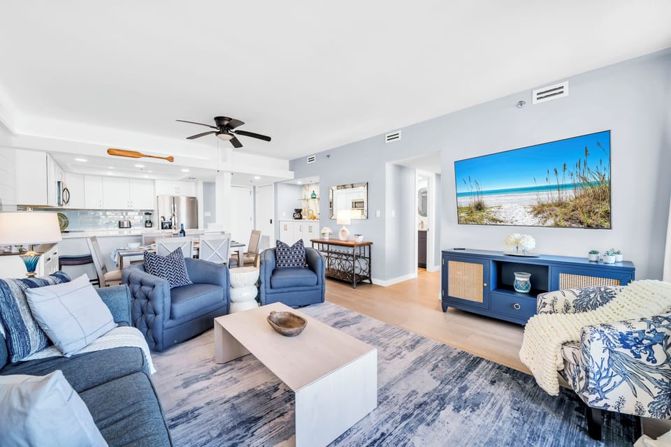 Sink into plush coastal comfort where beach-inspired artwork and soft textures create your perfect retreat after exploring the area.