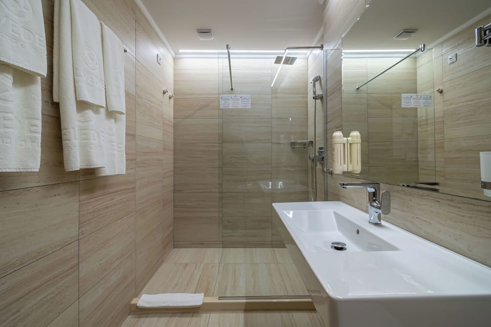 Shower, free toiletries, hair dryer, towels